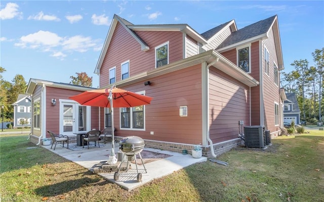 126 Secretariat Dr, Suffolk, VA 23435 - back of house featuring central air condition unit, a lawn, and a patio