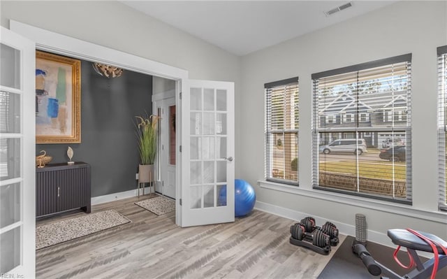 126 Secretariat Dr, Suffolk, VA 23435 - workout room with french doors, wood finished floors, and baseboards