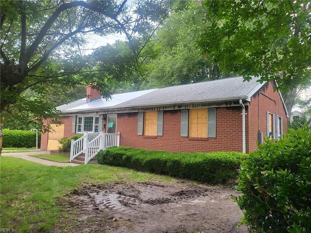 72 Cline Dr, Hampton, VA 23666 - single story home with brick siding, a chimney, and a front yard