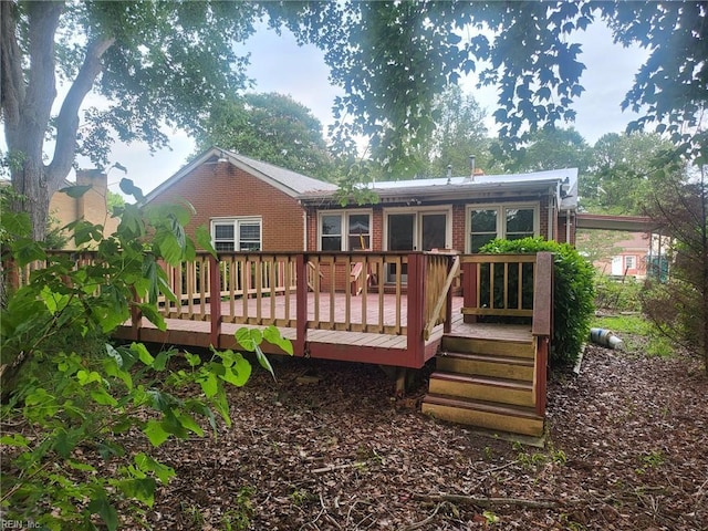 72 Cline Dr, Hampton, VA 23666 - rear view of property with brick siding and a deck