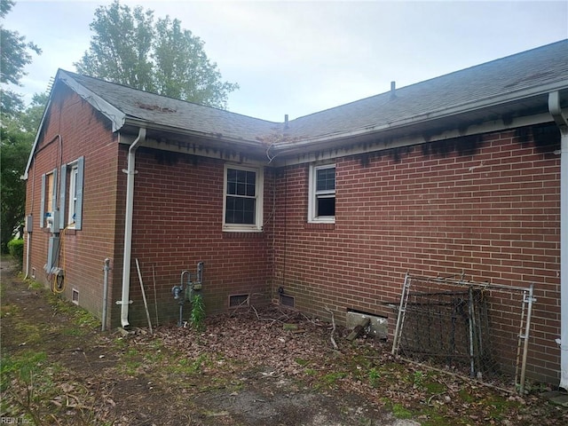 72 Cline Dr, Hampton, VA 23666 - view of side of property featuring brick siding, crawl space, and a shingled roof