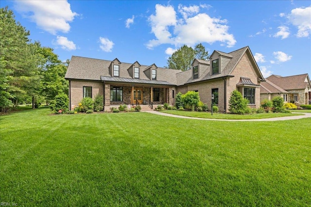 107 Gullane, Smithfield, VA 23430 - cape cod-style house with a porch, a front lawn, a standing seam roof, and brick siding