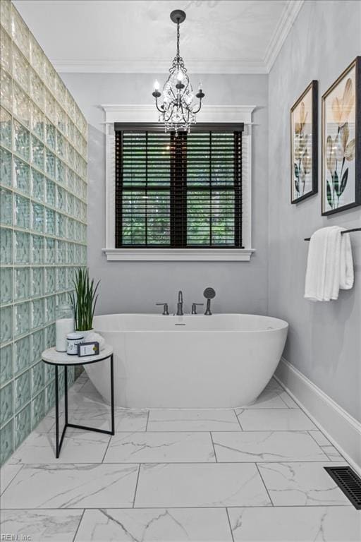 107 Gullane, Smithfield, VA 23430 - bathroom with marble finish floors, a freestanding bath, ornamental molding, and a chandelier