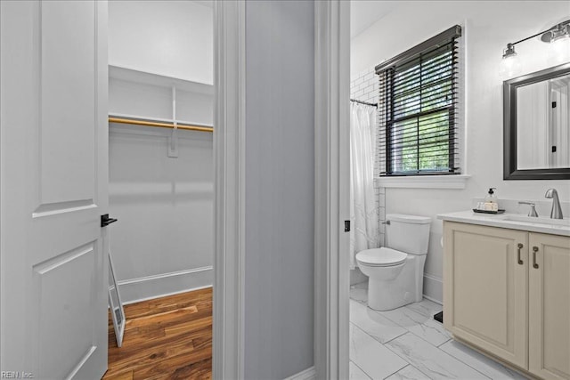 107 Gullane, Smithfield, VA 23430 - full bath featuring vanity, toilet, a spacious closet, marble look tile flooring, and baseboards