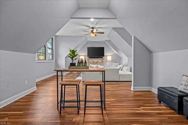 107 Gullane, Smithfield, VA 23430 - kitchen featuring ceiling fan, dark wood-type flooring, vaulted ceiling, baseboards, and open floor plan