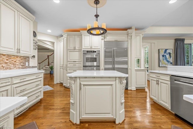 201 Royal Dornoch, Smithfield, VA 23430 - kitchen featuring appliances with stainless steel finishes, light countertops, a kitchen island, recessed lighting, and hanging light fixtures