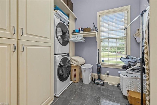 201 Royal Dornoch, Smithfield, VA 23430 - laundry area with estacked washer and dryer, baseboards, and cabinet space