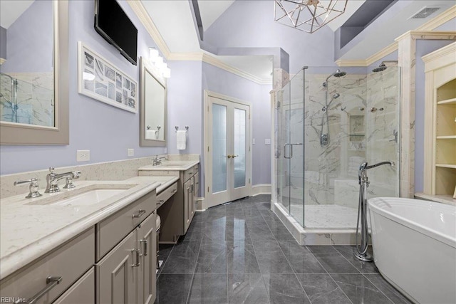 201 Royal Dornoch, Smithfield, VA 23430 - full bathroom with ornamental molding, a marble finish shower, french doors, two vanities, and a freestanding tub