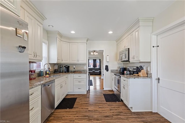 133 Chesterfield Rd, Hampton, VA 23661 - kitchen with appliances with stainless steel finishes, a sink, tasteful backsplash, recessed lighting, and light stone counters