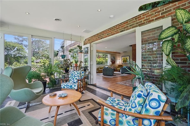 6076 Newport Pt, Norfolk, VA 23505 - sunroom / solarium with tile patterned floors, recessed lighting, and brick wall