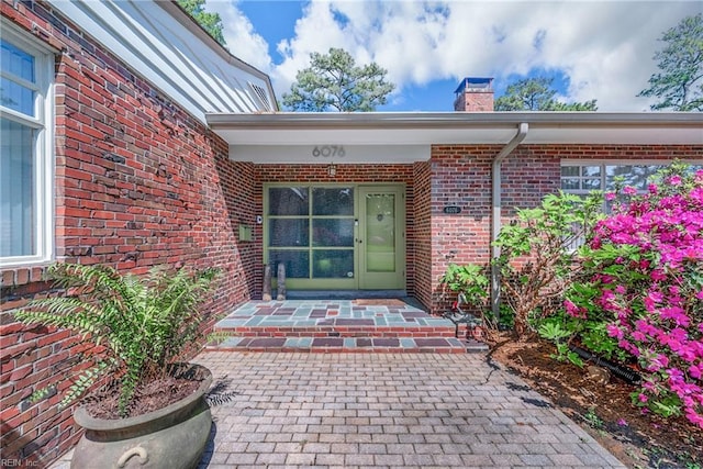 6076 Newport Pt, Norfolk, VA 23505 - entrance to property featuring a chimney and brick siding