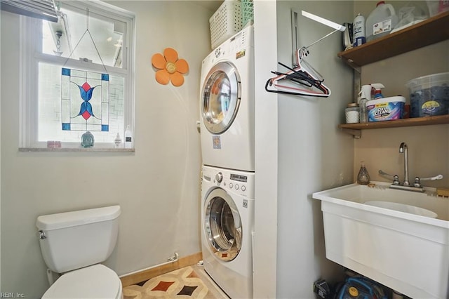 6076 Newport Pt, Norfolk, VA 23505 - laundry room featuring stacked washing machine and dryer and baseboards