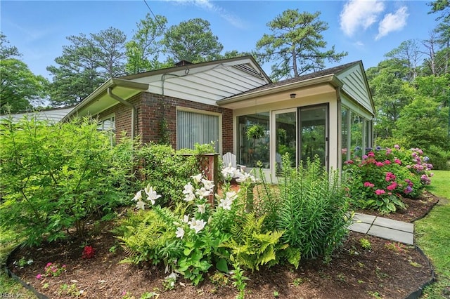 6076 Newport Pt, Norfolk, VA 23505 - view of front of home featuring brick siding and a sunroom