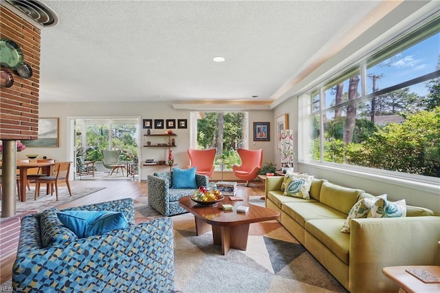 6076 Newport Pt, Norfolk, VA 23505 - living area with plenty of natural light, a textured ceiling, and wood finished floors