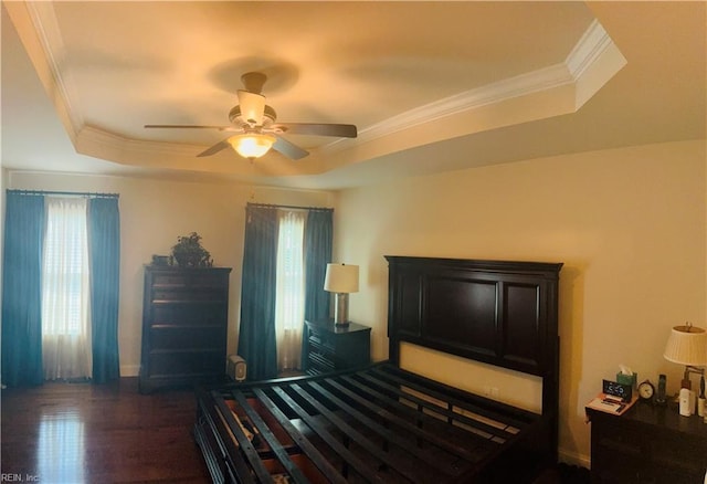 4296 Beamers Rdg, Williamsburg, VA 23188 - bedroom featuring a tray ceiling, dark wood-style floors, crown molding, baseboards, and a ceiling fan