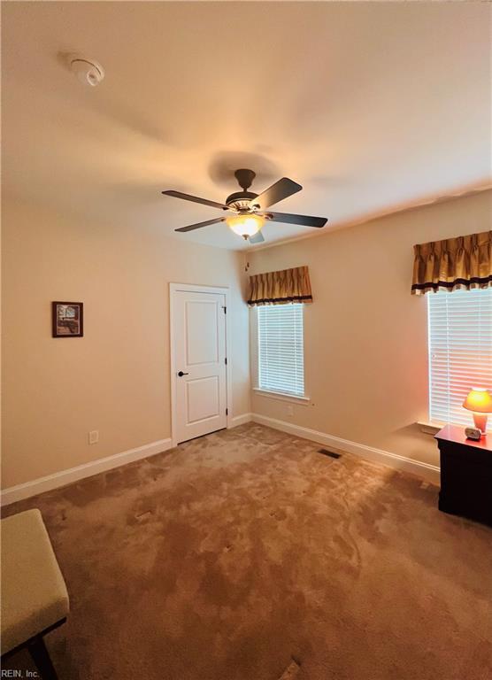 4296 Beamers Rdg, Williamsburg, VA 23188 - spare room with carpet floors, a ceiling fan, and baseboards