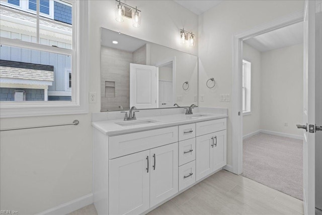206 84th St Unit A, Virginia Beach, VA 23451 - full bath with baseboards, double vanity, and plenty of natural light