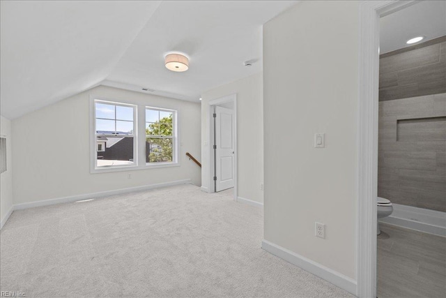 206 84th St Unit A, Virginia Beach, VA 23451 - bonus room featuring baseboards, lofted ceiling, and carpet floors