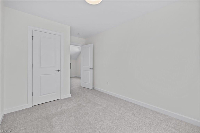 206 84th St Unit A, Virginia Beach, VA 23451 - unfurnished bedroom featuring carpet flooring, baseboards, and vaulted ceiling