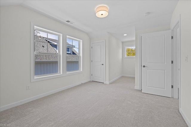 206 84th St Unit A, Virginia Beach, VA 23451 - unfurnished bedroom with light colored carpet, multiple windows, and baseboards
