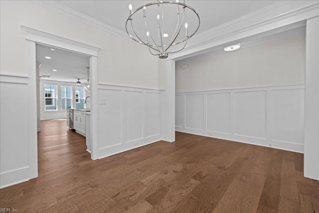 206 84th St Unit A, Virginia Beach, VA 23451 - unfurnished dining area with a decorative wall, ornamental molding, a chandelier, wood finished floors, and wainscoting