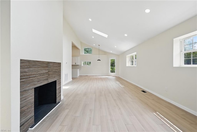 1202 Land St, Norfolk, VA 23502 - unfurnished living room with a fireplace, light wood-style flooring, baseboards, recessed lighting, and high vaulted ceiling