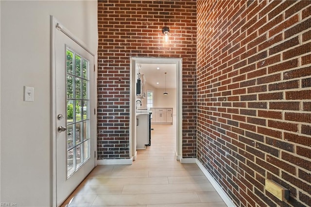 1202 Land St, Norfolk, VA 23502 - hall with brick wall and baseboards