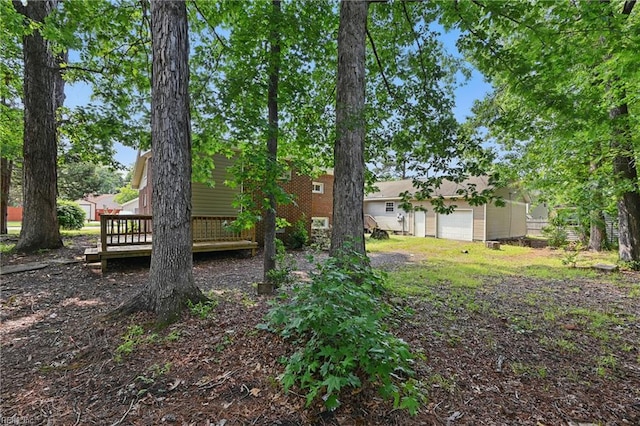 1202 Land St, Norfolk, VA 23502 - view of yard featuring a deck and a garage