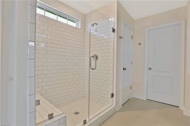 2221 Patrick Dr, Suffolk, VA 23435 - bathroom featuring a stall shower, tile patterned floors, and baseboards