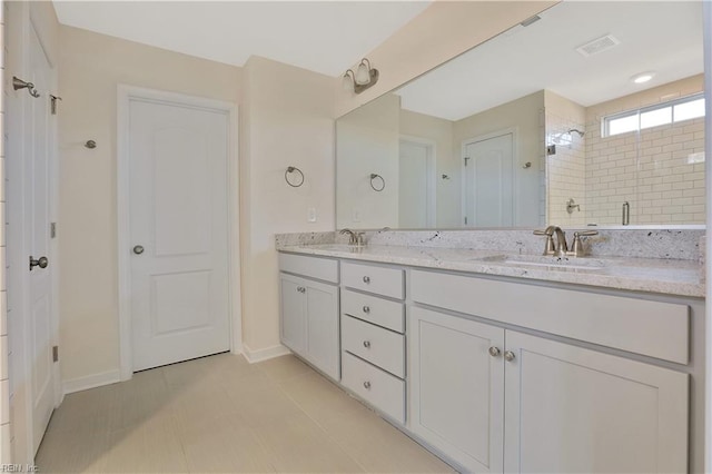 2221 Patrick Dr, Suffolk, VA 23435 - bathroom with double vanity, baseboards, and a shower stall