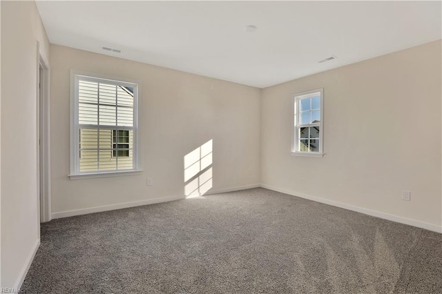 2221 Patrick Dr, Suffolk, VA 23435 - carpeted empty room featuring healthy amount of natural light and baseboards