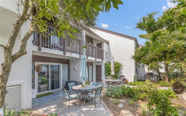4004 Atlantic Ave Unit Cs9, Virginia Beach, VA 23451 - view of patio featuring outdoor dining area and a balcony