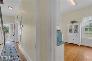 96 Doctors Creek Rd, New Point, VA 23125 - hall with plenty of natural light, light wood-style floors, and baseboards