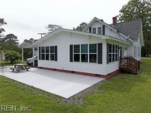 96 Doctors Creek Rd, New Point, VA 23125 - rear view of property with a patio, crawl space, a lawn, and a chimney