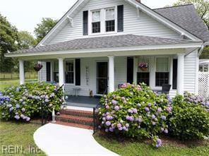 96 Doctors Creek Rd, New Point, VA 23125 - view of front facade featuring a porch and roof with shingles