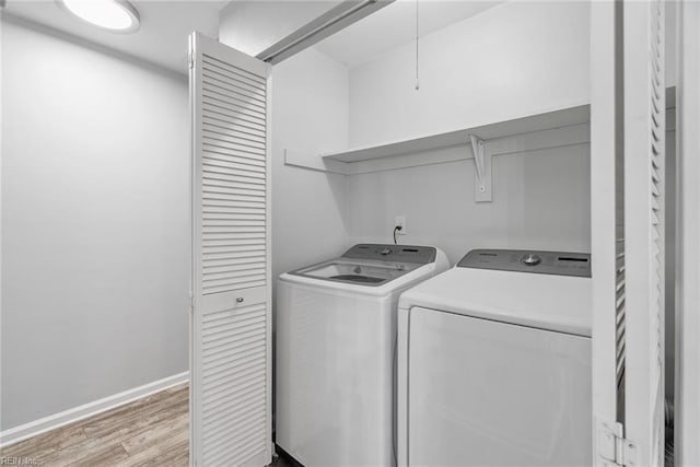 1016 Gauguin Dr, Virginia Beach, VA 23454 - laundry area featuring washing machine and clothes dryer, light wood-style flooring, and baseboards