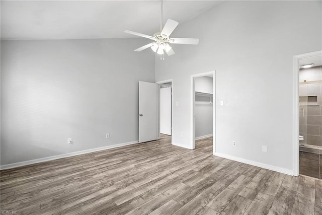 1016 Gauguin Dr, Virginia Beach, VA 23454 - unfurnished bedroom featuring high vaulted ceiling, wood finished floors, baseboards, ensuite bath, and a spacious closet
