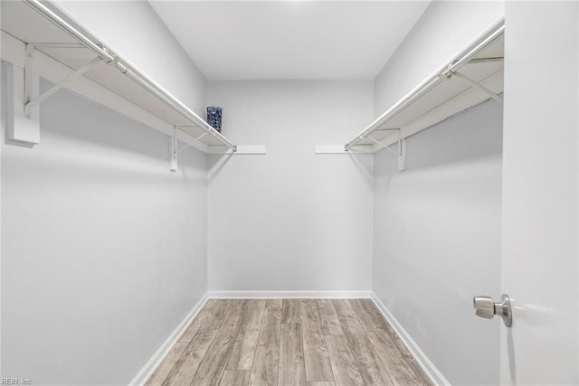 1016 Gauguin Dr, Virginia Beach, VA 23454 - walk in closet with wood finished floors