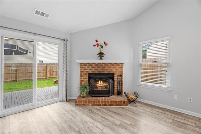 1016 Gauguin Dr, Virginia Beach, VA 23454 - unfurnished living room featuring wood finished floors, a fireplace, and baseboards