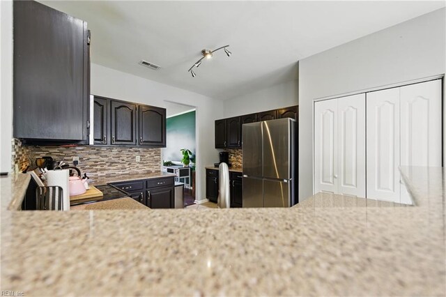 3507 Sedgefield St, Suffolk, VA 23435 - kitchen with freestanding refrigerator and decorative backsplash