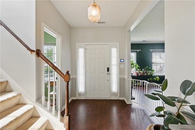 3507 Sedgefield St, Suffolk, VA 23435 - foyer with wood finished floors, stairway, and baseboards