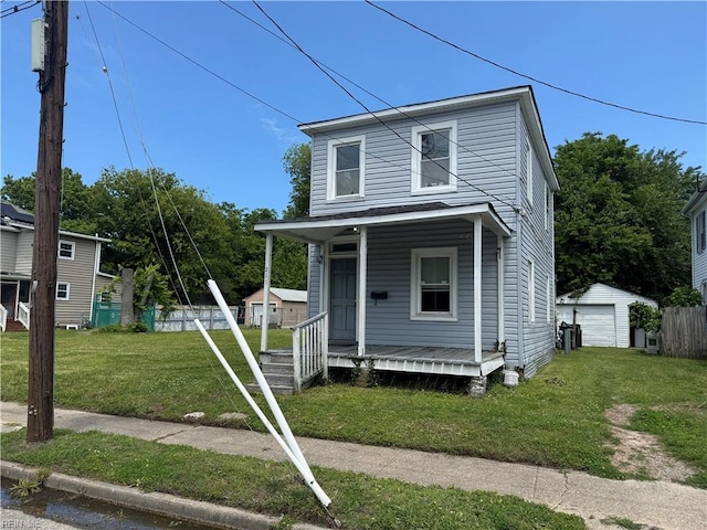215 E Howard St, Hampton, VA 23663 - view of front of house featuring covered porch, an outdoor structure, and a garage