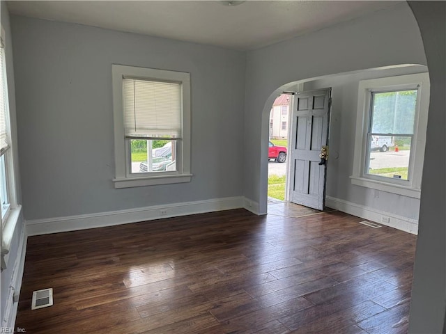 215 E Howard St, Hampton, VA 23663 - entrance foyer with arched walkways, plenty of natural light, wood-type flooring, and baseboards