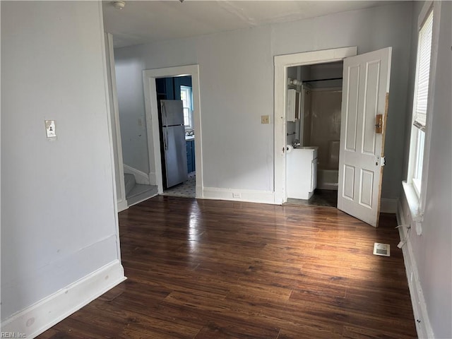 215 E Howard St, Hampton, VA 23663 - spare room with plenty of natural light, dark wood-type flooring, and baseboards