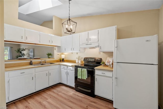 3912 Pollypine Dr, Virginia Beach, VA 23452 - kitchen with freestanding refrigerator, electric range, under cabinet range hood, a sink, and a chandelier