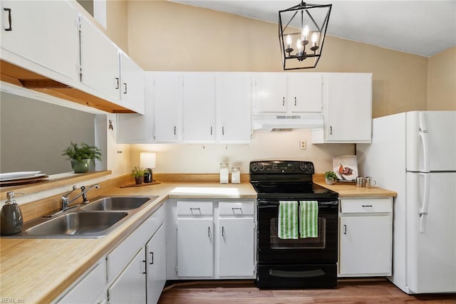 3912 Pollypine Dr, Virginia Beach, VA 23452 - kitchen with black range with electric stovetop, freestanding refrigerator, a sink, under cabinet range hood, and lofted ceiling