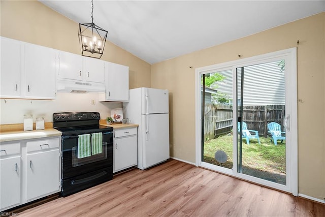 3912 Pollypine Dr, Virginia Beach, VA 23452 - kitchen featuring black range with electric cooktop, freestanding refrigerator, under cabinet range hood, lofted ceiling, and light countertops