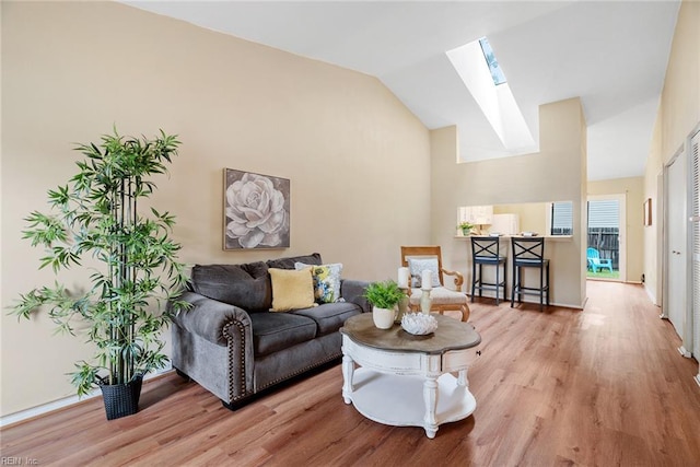 3912 Pollypine Dr, Virginia Beach, VA 23452 - living area featuring a skylight, light wood-style flooring, and high vaulted ceiling