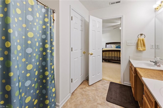 103 Barcroft Dr, Smithfield, VA 23430 - ensuite bathroom featuring vanity, tile patterned floors, baseboards, and a shower with shower curtain