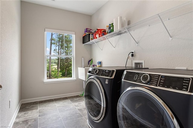 5060 Riverfront Dr, Suffolk, VA 23434 - washroom featuring washer and dryer, healthy amount of natural light, and baseboards